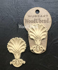 WoodUBend Applique #2447 (set of 2) is the perfect mouldable embellishment for any project!
The Applique #2447 (set of 2) is seen with one in the packaging and the other one without on a black crinkled background.