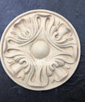 WoodUBend Applique #6013 (Set of 2) is the perfect mouldable embellishment for any project! This image shows one Applique #6013 (Set of 2) up close against a black background.
