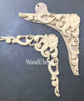 WoodUBend Applique #6069 (Set of 2) is the perfect mouldable embellishment for any project!
There are two Appliques in this picture.  The are identical.  These would be perfect to a corner embellishment because they are curved like a corner.  In the top of the bend there is a "sea shell" design.  From the bottom of the shell there looks like two waves  going in either direction of each other.  From that there are other wave looking frills.  The length of each side looks to be about 3 inches long.