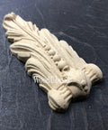 WoodUBend Applique #6076 (Set of 2) is the perfect mouldable embellishment for any project!
One of the Applique #6076 (Set of 2) out of the packaging and upside down staged on a black crinkled background.