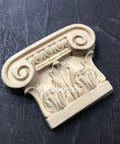 WoodUBend Applique #6079 (Set of 2) is the perfect mouldable embellishment for any project!
One of the Applique #6079 (Set of 2) is seen flat staged on a black crinkled background.
