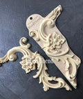WoodUBend Corner Applique #6025 (set of 2) is the perfect mouldable embellishment for any project!
There are two corner woo-u-bend moldings resting on black leather.  One is out of the packaging and the other is still in the packaging.  They are facing away from each other.  They would be perfect for any DIY furniture project.