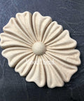 WoodUBend Floral Applique #1333.1 (Set of 2) is the perfect mouldable embellishment for any project!
Image shows one of the Floral Applique #1333.1 Set of 2 out of the packaging, staged on an angle on a black background.
