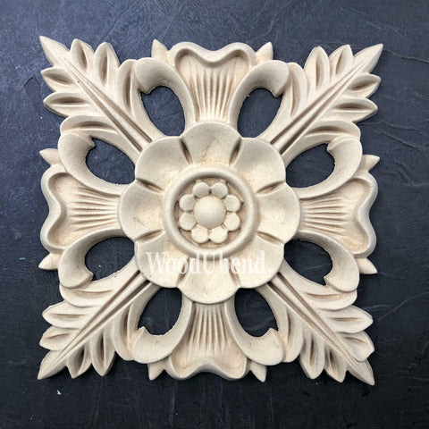 WoodUBend Floral Applique #1352.18 (Set of 2) is the perfect mouldable embellishment for any project!
Image shows one of the Floral Applique #1352.18 Set of 2 out of the packaging, staged flat on a black background.