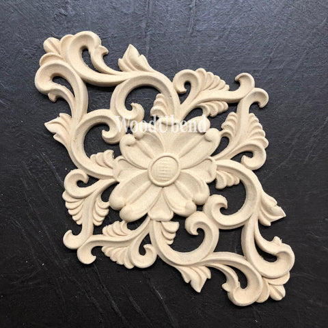 WoodUBend Floral Applique #2157 (set of 2)
This is just one of the Appliques is laying out, diagonally, on a crinkled, black leather surface.