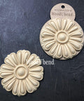 WoodUBend Floral Applique #6099 (Set of 2) is the perfect mouldable embellishment for any project!
The Floral Applique #6099 (Set of 2) one being in the packaging and the other without. Staged on a a black crinkled background.