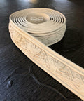 WoodUBend Trim #TR009 is the perfect mouldable embellishment for any project!  A roll of WoodUBend Trim #TR009 lying on a table with 1 end unrolled.