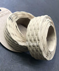WoodUBend Trim #TR716 (Set of 2) is the perfect mouldable embellishment for any project!  Two rolls of WoodUbend sitting on top of a brown piece of paper with WoodUbend WUBTR716 printed at the top; all are sitting on a black table.